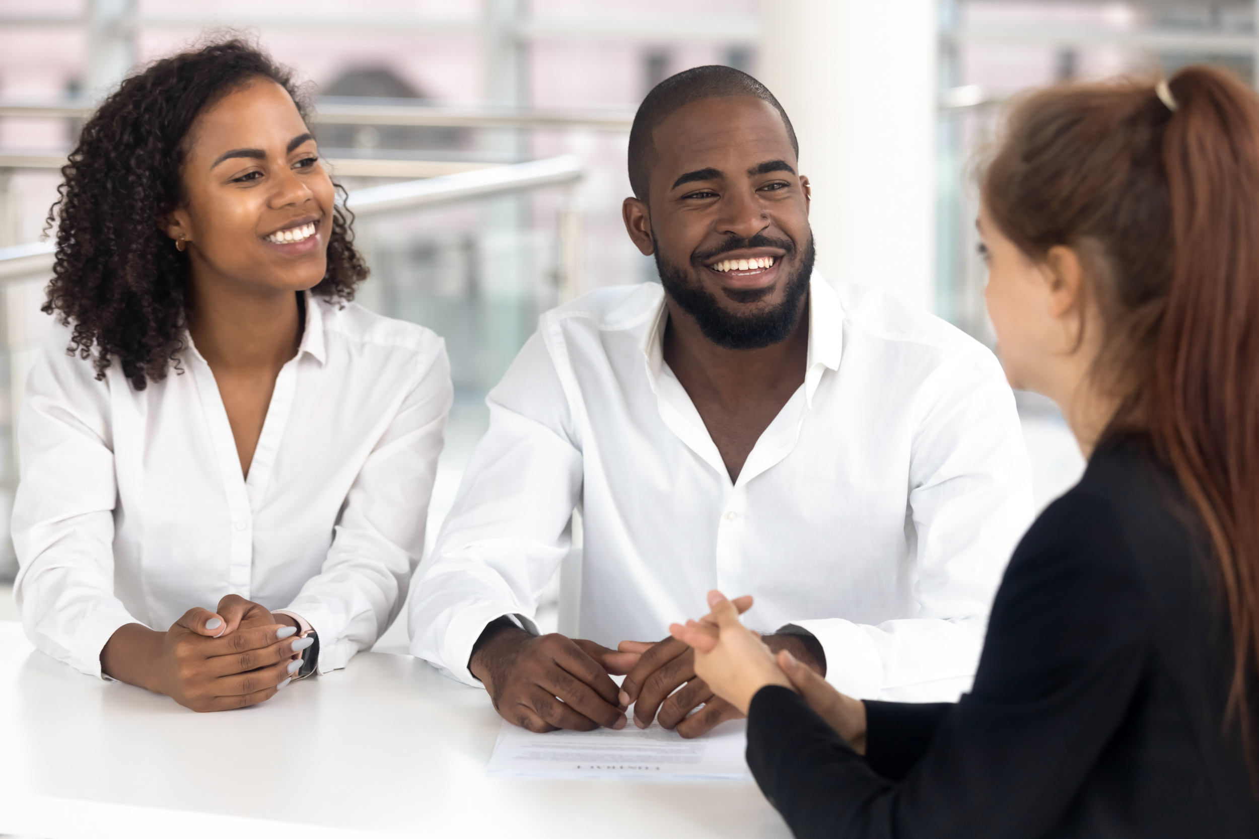 A young couple meets with a realtor